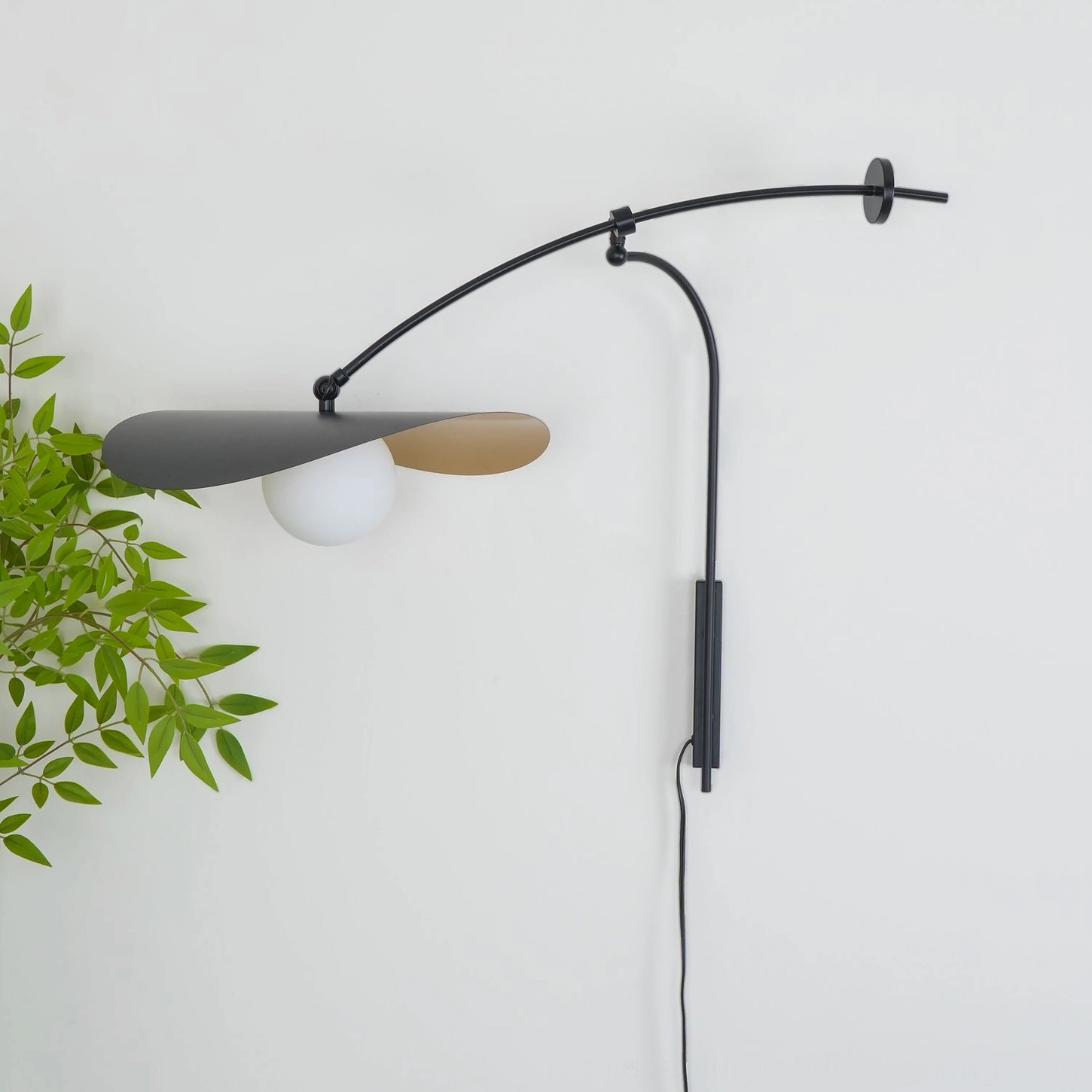 Myrna plug-in wall lamp original factory image, sculptural black and gold design