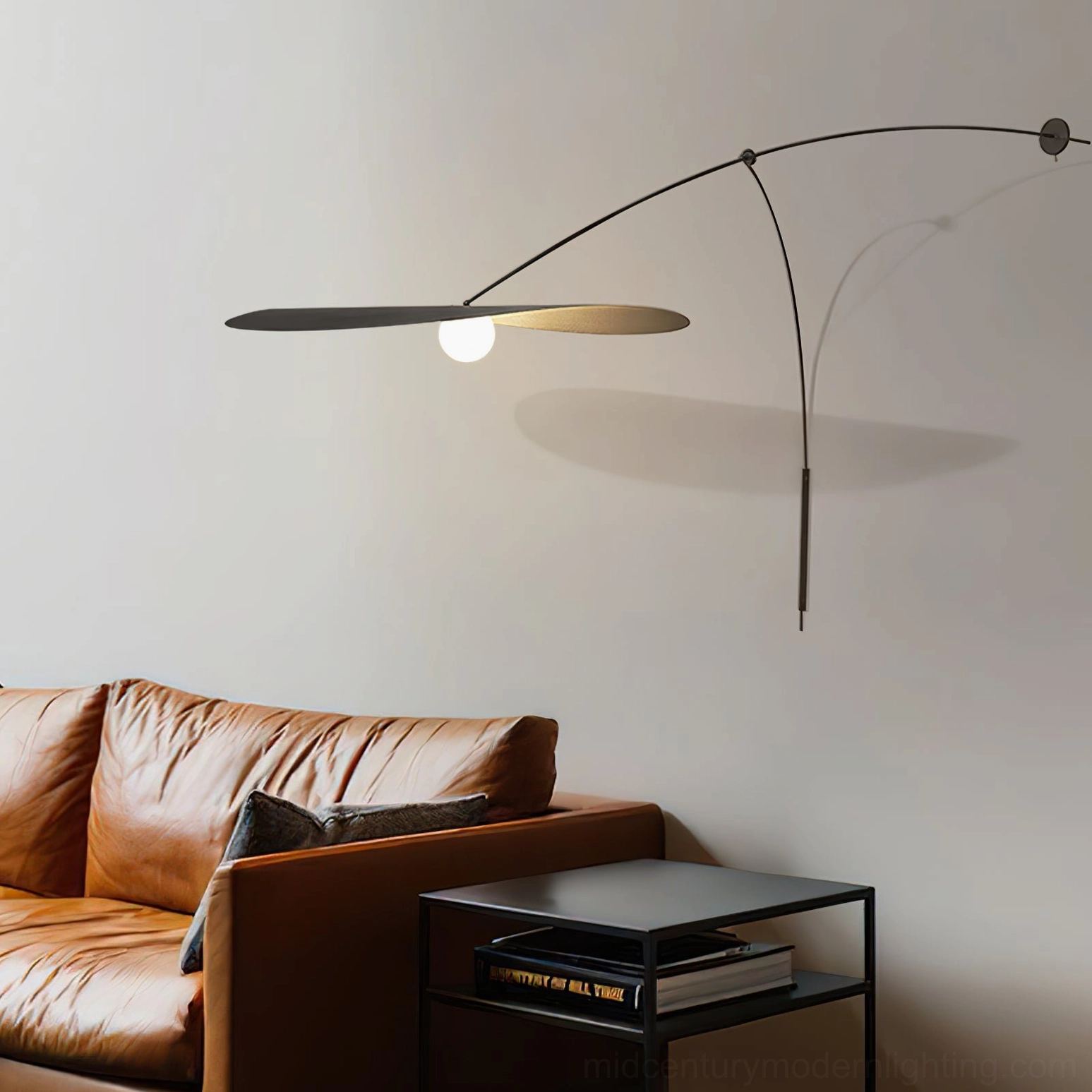 Myrna wall lamp mounted in modern living room with leather sofa, warm ambient lighting casting shadows