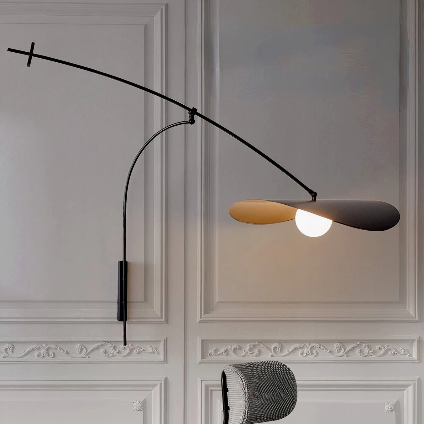 Myrna plug-in wall lamp in French-style neoclassical interior with carved wall panels, long curved metal arm
