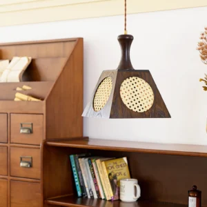 Mid-century modern wooden pendant lamp displayed in vintage study room with antique secretary cabinet, side angle showing hand-woven rattan detail