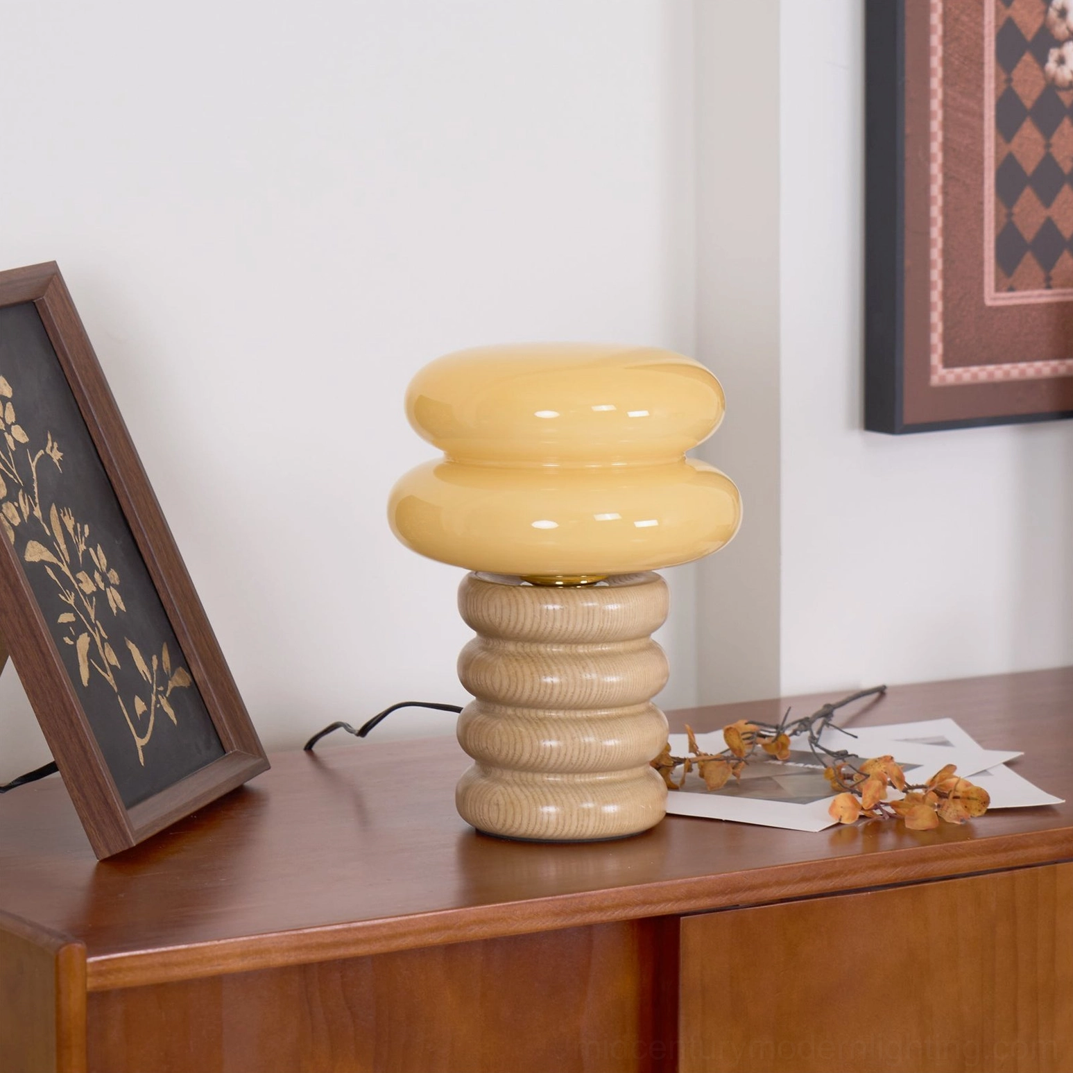 Napako table lamp with warm ambient illumination through frosted glass shade creating inviting bedroom or office lighting