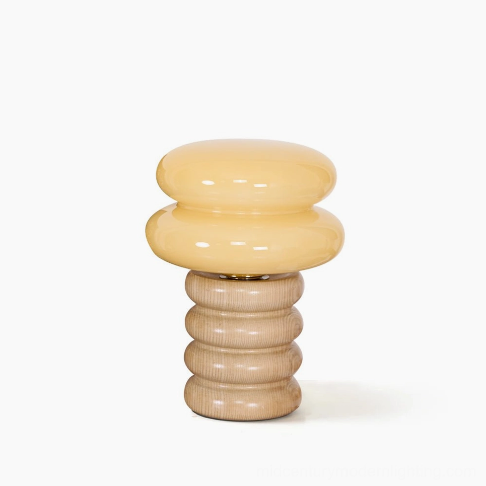 Artistic overhead view of Napako stacked wood table lamp base showing grain patterns and minimalist profile from above
