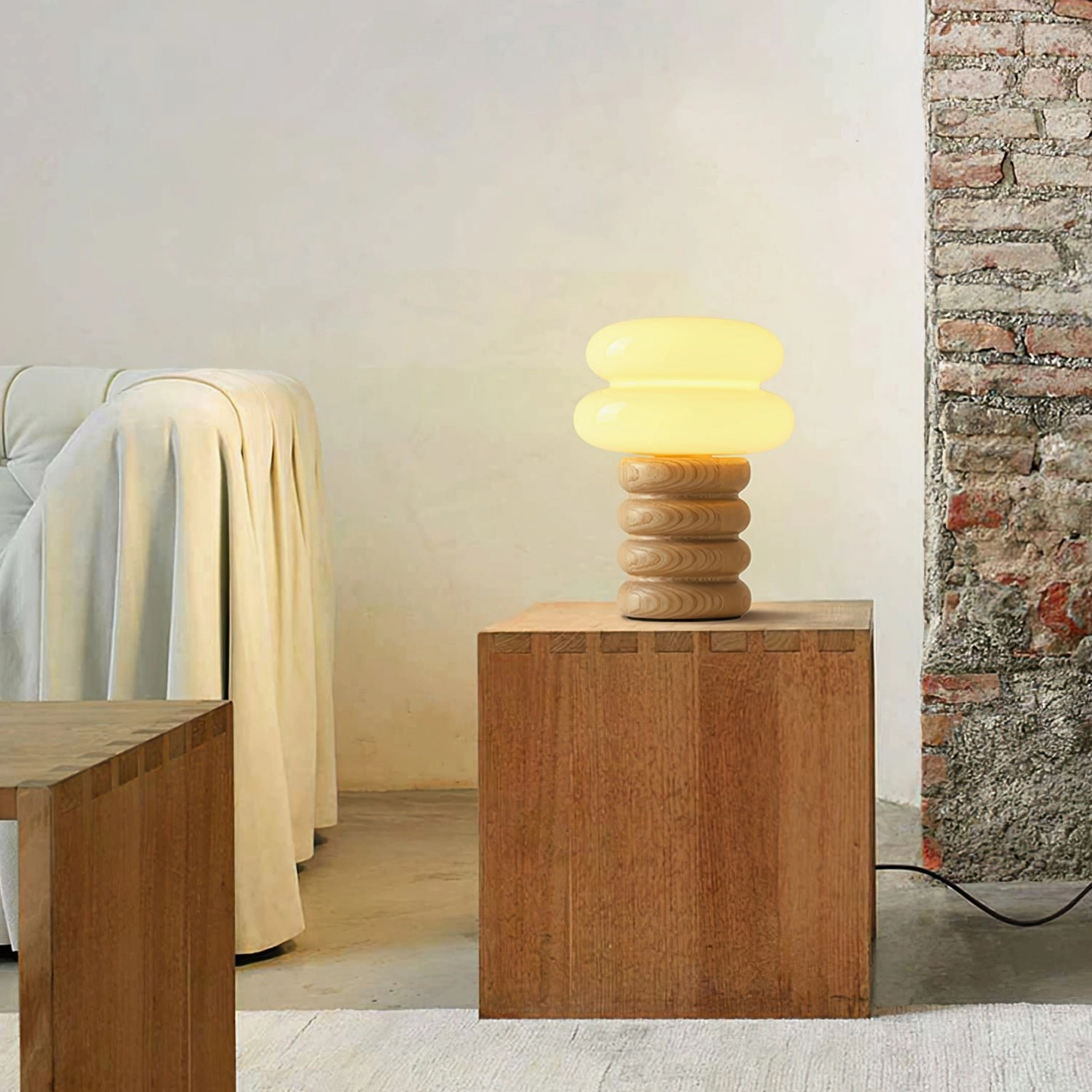Vintage-inspired Napako table lamp with creamy glass shade and hand-spliced ash wood base in retro home setting
