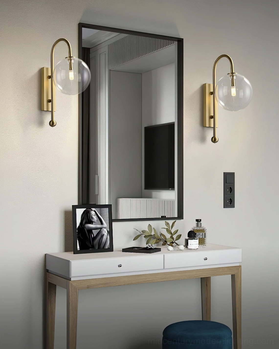 Pair of dual glass globe wall lamps mounted above vanity mirror in bedroom with matching decor