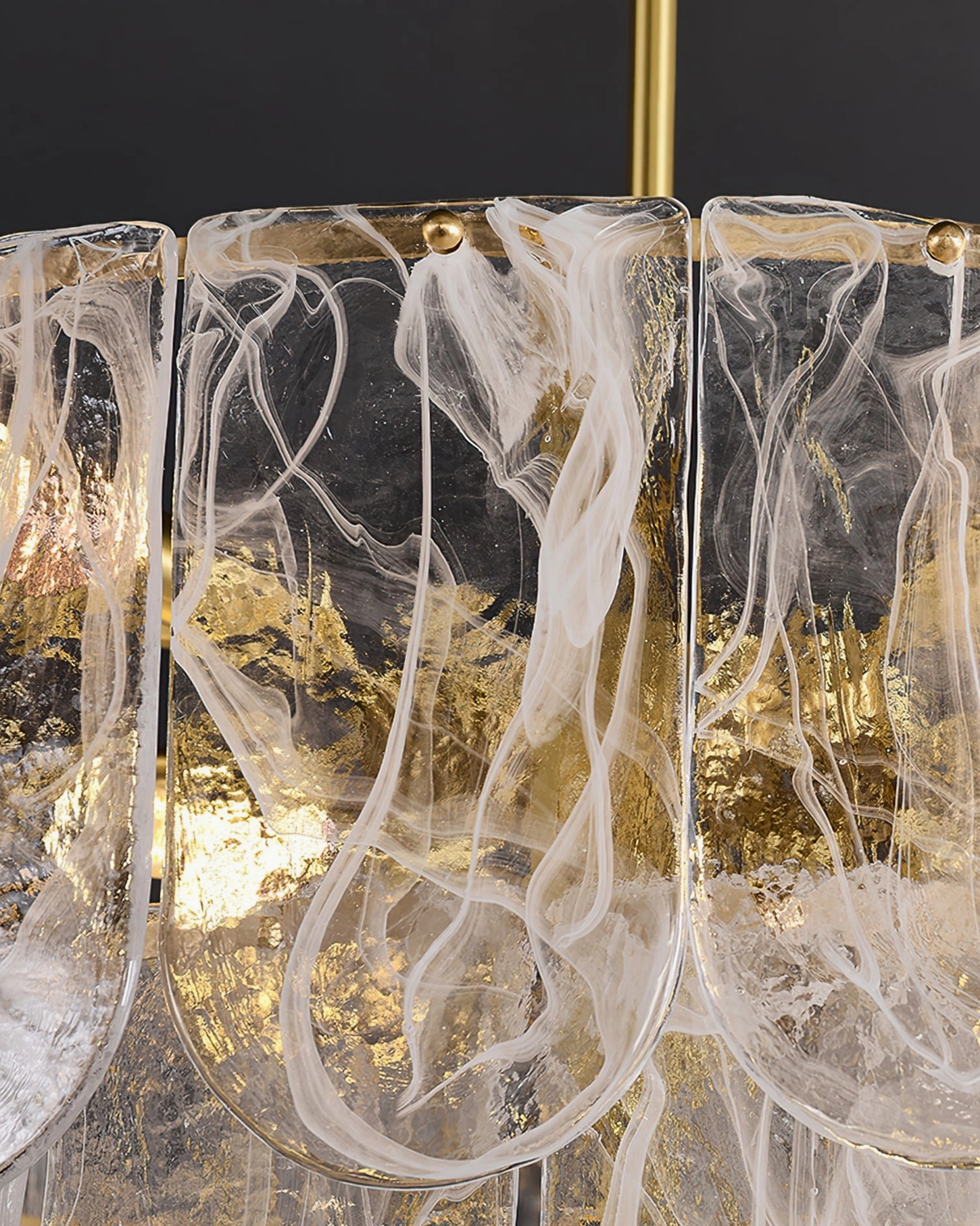 Nason brass chandelier illuminated in evening setting demonstrating ambient light quality and brass glow