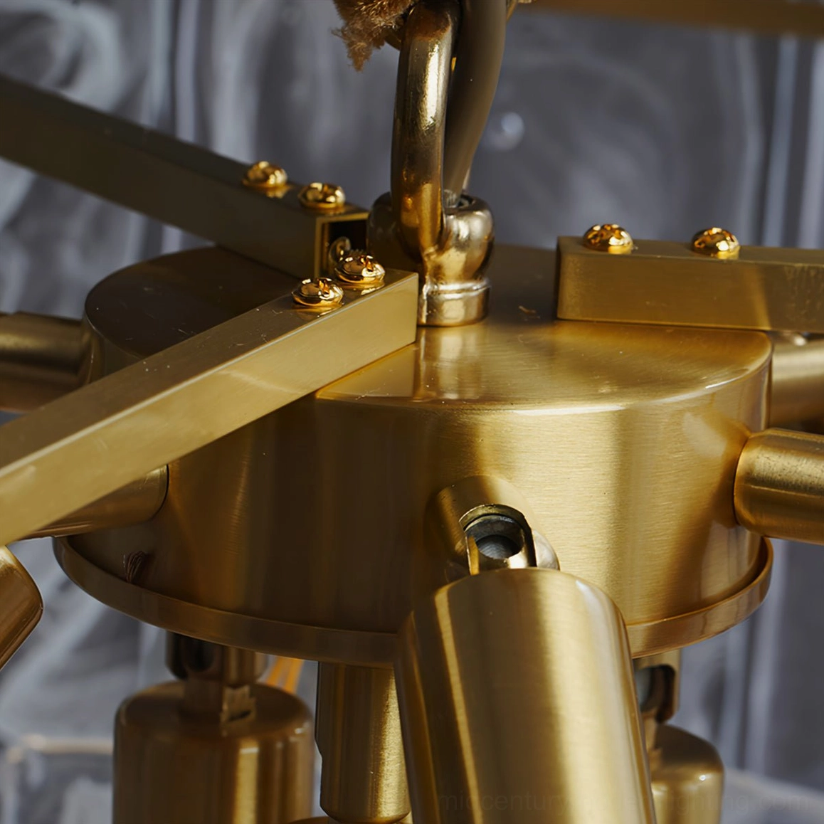 Medium Nason brass chandelier installed in contemporary interior showcasing scale and light distribution