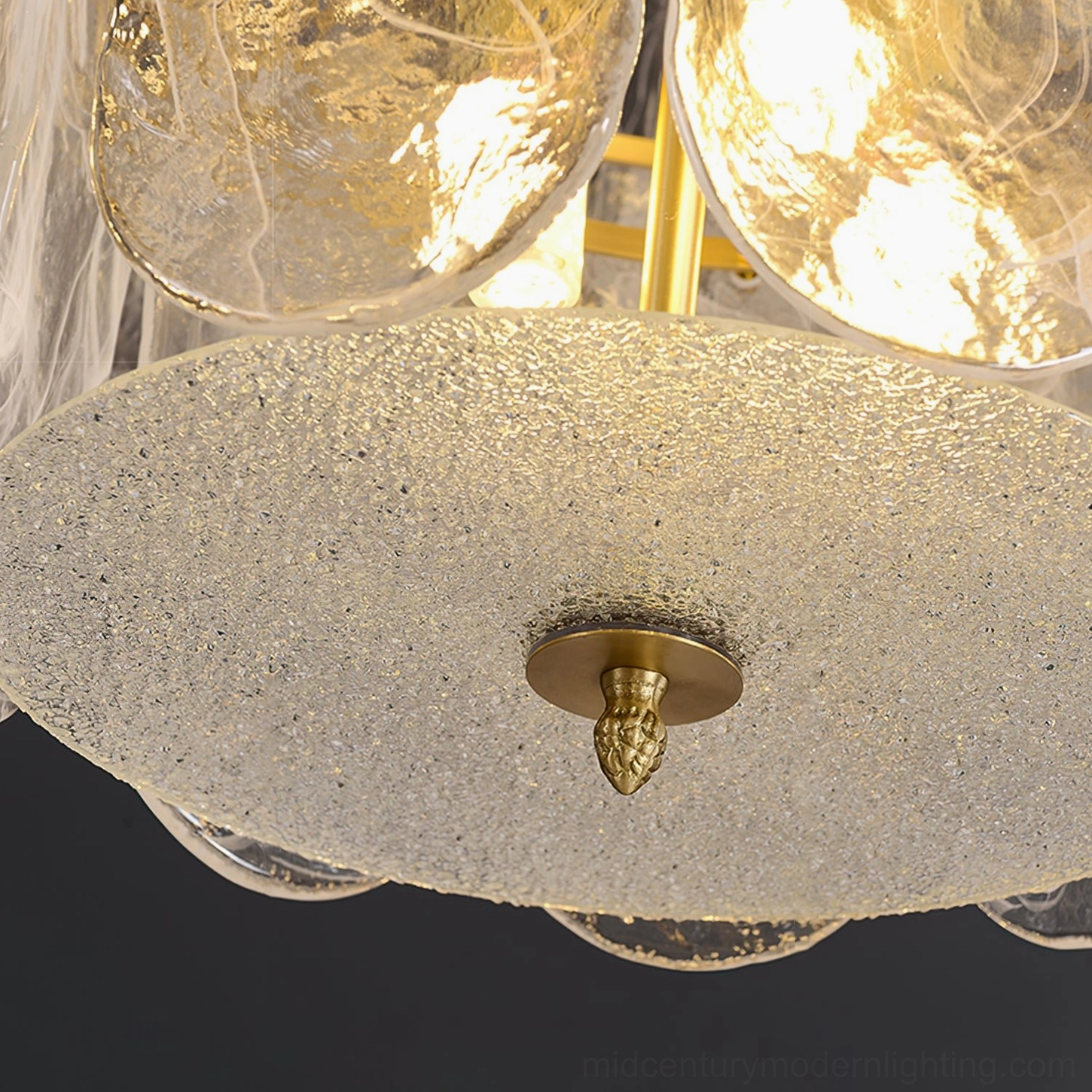 Nason brass chandelier multiple tiers showing light refraction through clear glass panels