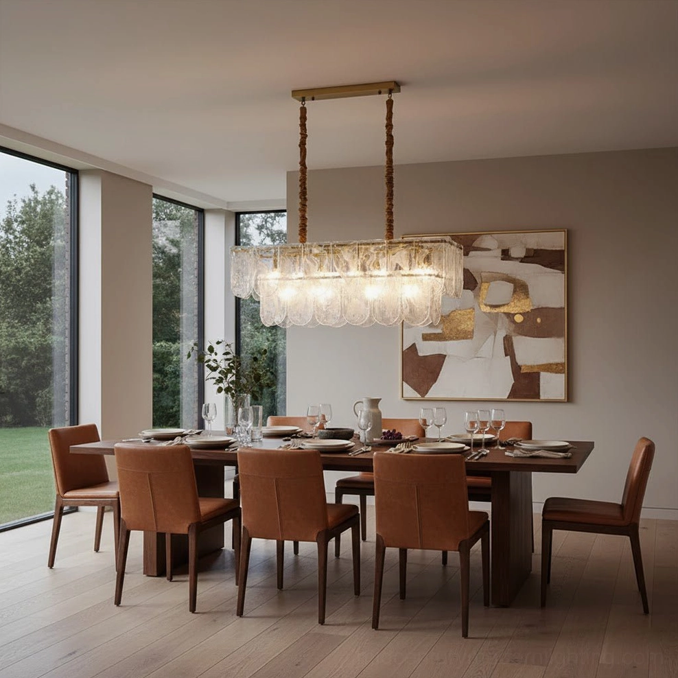 Linear Nason brass chandelier with rectangular tiered glass shades in contemporary white marble kitchen setting