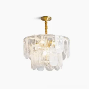 Nason brass chandelier with tiered round glass shades, frontal overhead view on white background showcasing modern minimalist design