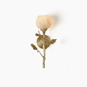 Natalia hand-carved alabaster wall sconce with tulip-shaped shade and brass branch detailing in front overhead studio view