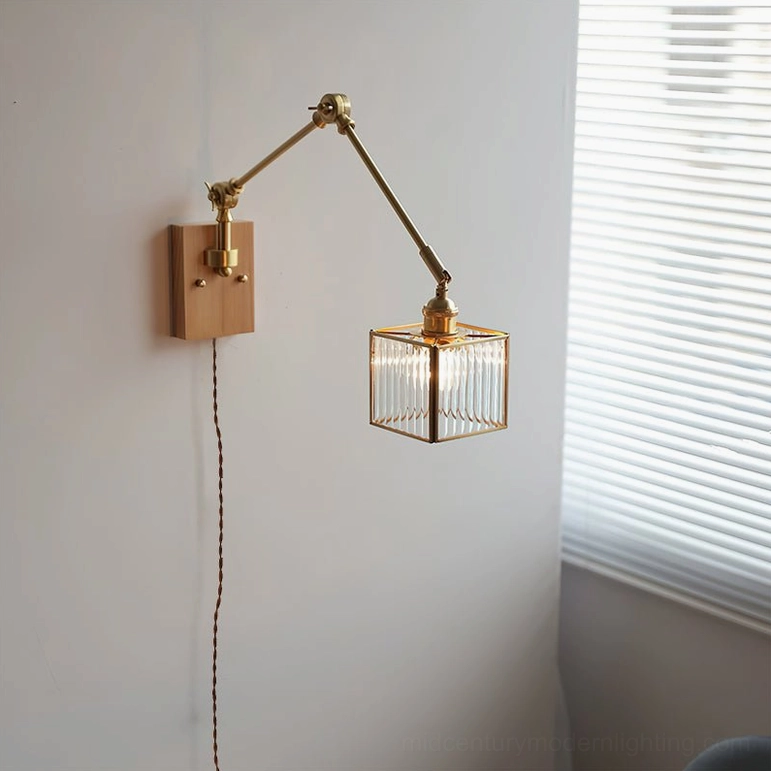 Single-arm swing wall lamp with light wood base positioned by louvered window, natural light interior design