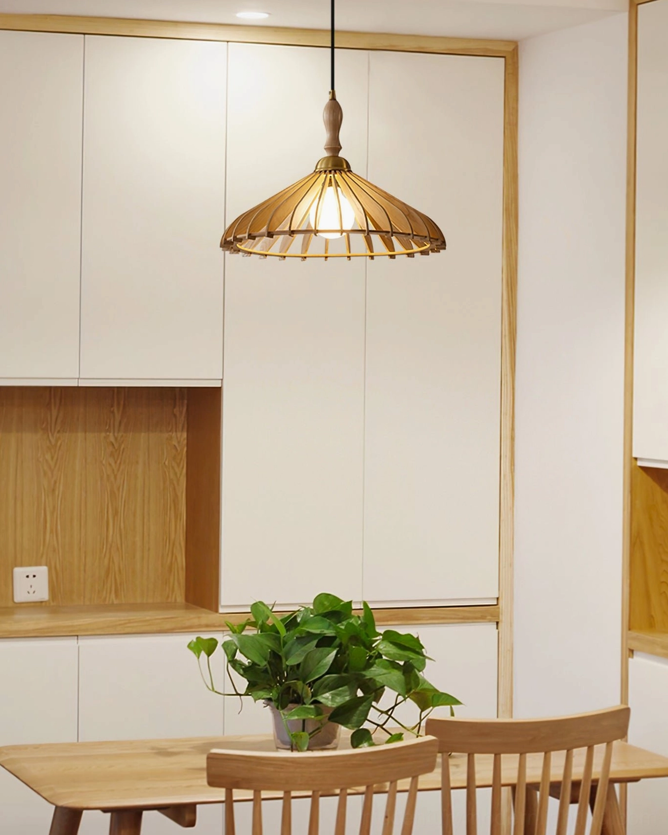 Light natural wood tone umbrella pendant lamp in small kitchen nook, warm japandi minimalist style