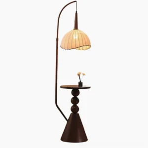 Naumy arc floor lamp with integrated wooden side table, front studio view showing dark brown metal frame and pleated beige fabric shade