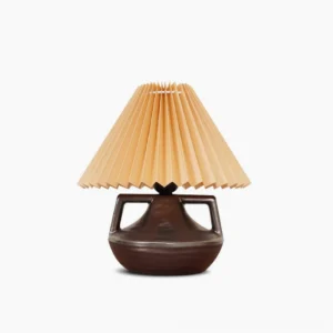 Navia pleated table lamp with ceramic base and khaki fabric shade, front view on white background