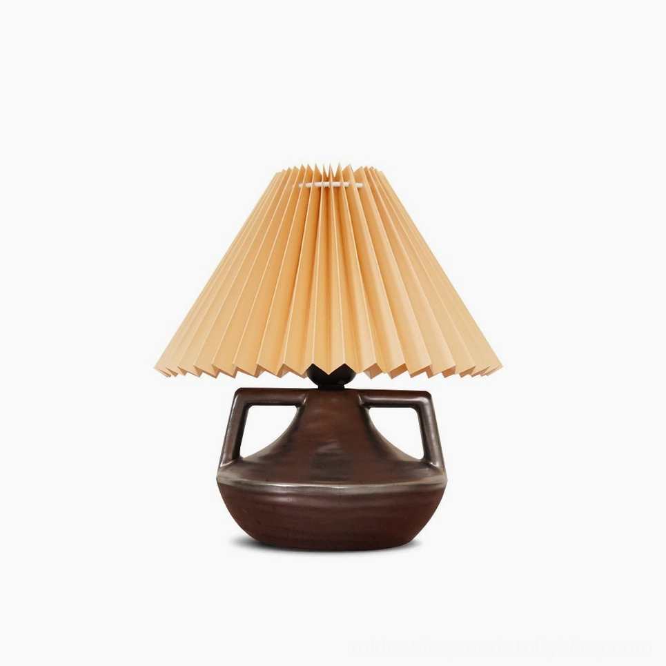 Navia pleated table lamp with ceramic base and khaki fabric shade, front view on white background