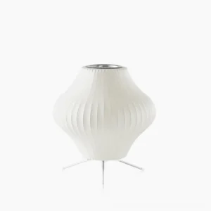 George Nelson bubble tripod table lamp with pear-shaped ribbed shade and silver metal tripod base on pure white studio background