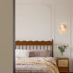 Nenufar wall lamp installed in vintage bedroom with wooden bed frame, mid-century modern sconce design
