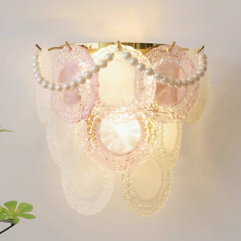 Close-up detail of Nenufar wall lamp showing colored rippled glass and pearl chain trim with warm light