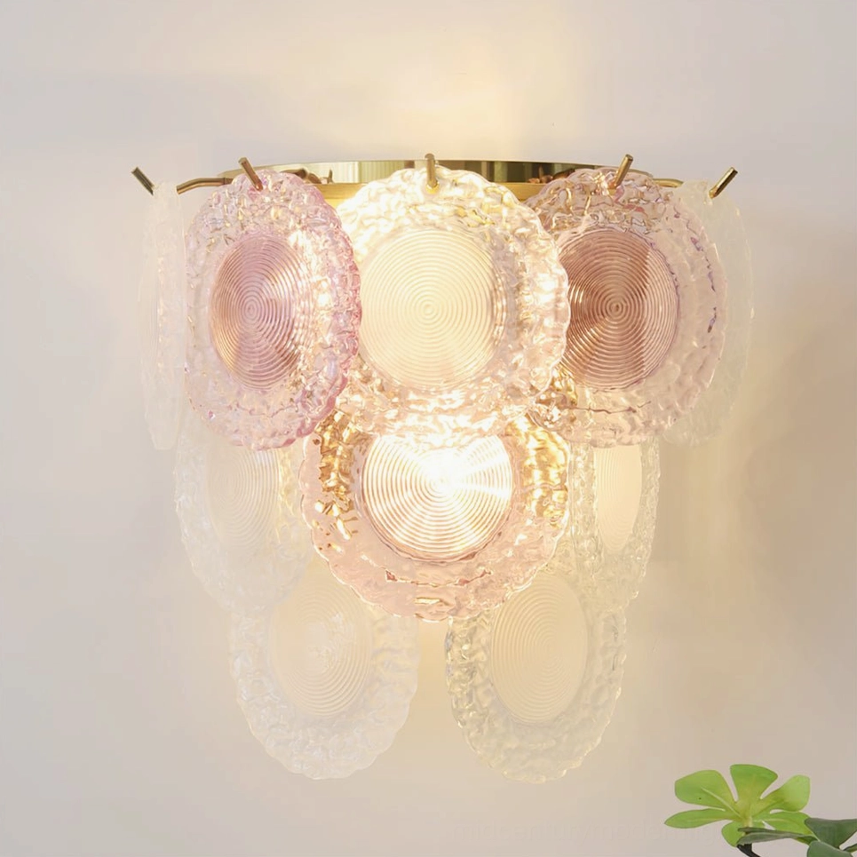 Nenufar wall lamp flat product shot with gold base and layered glass shades, romantic warm lighting