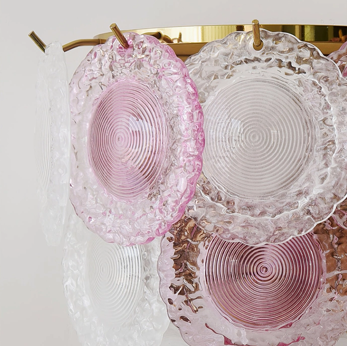 Side angle view of Nenufar wall lamp highlighting gradient glass panels and gold hardware accents