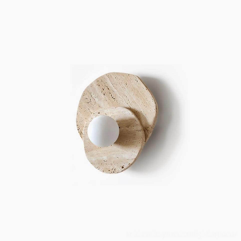 Ner natural travertine wall sconce with frosted glass diffuser, front view on white background showcasing organic asymmetrical stone texture