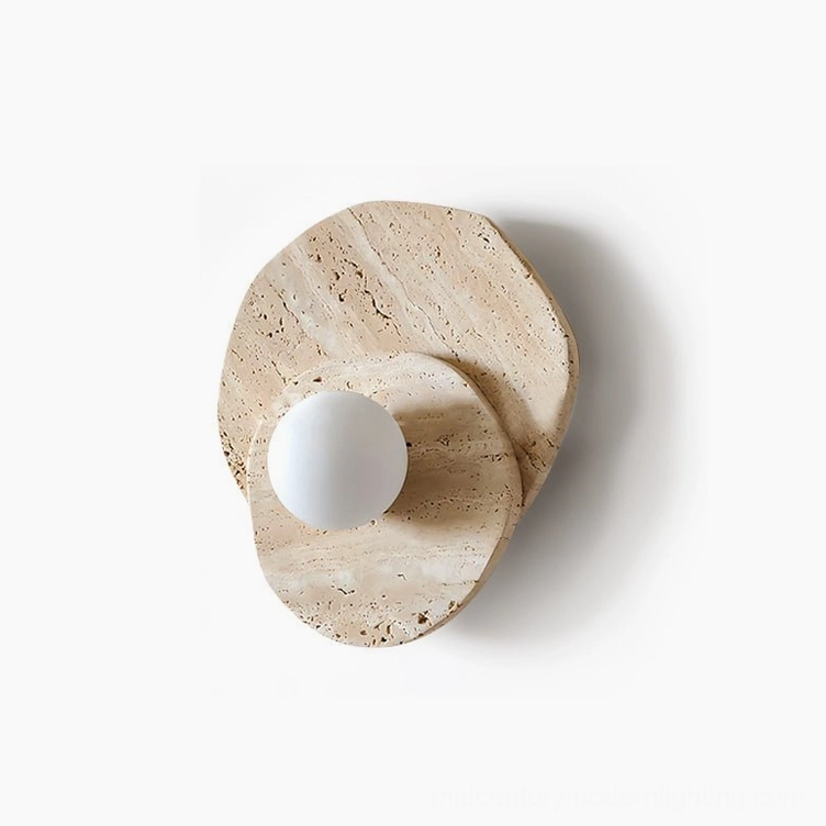 Ner travertine wall sconce wide-angle view in living room with armchair and side table, mid-century modern ambiance