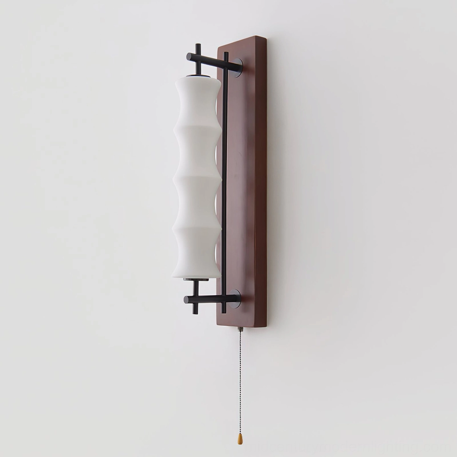 Nesta sconce installation mounted on hallway wall, warm light diffusing through wavy glass for ambient corridor lighting
