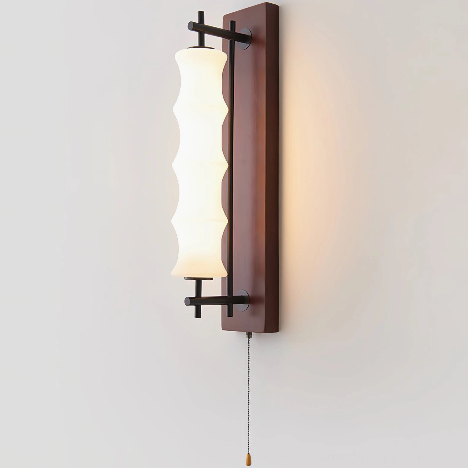 Nesta wall sconce with integrated LED demonstrating light diffusion through rippled borosilicate glass