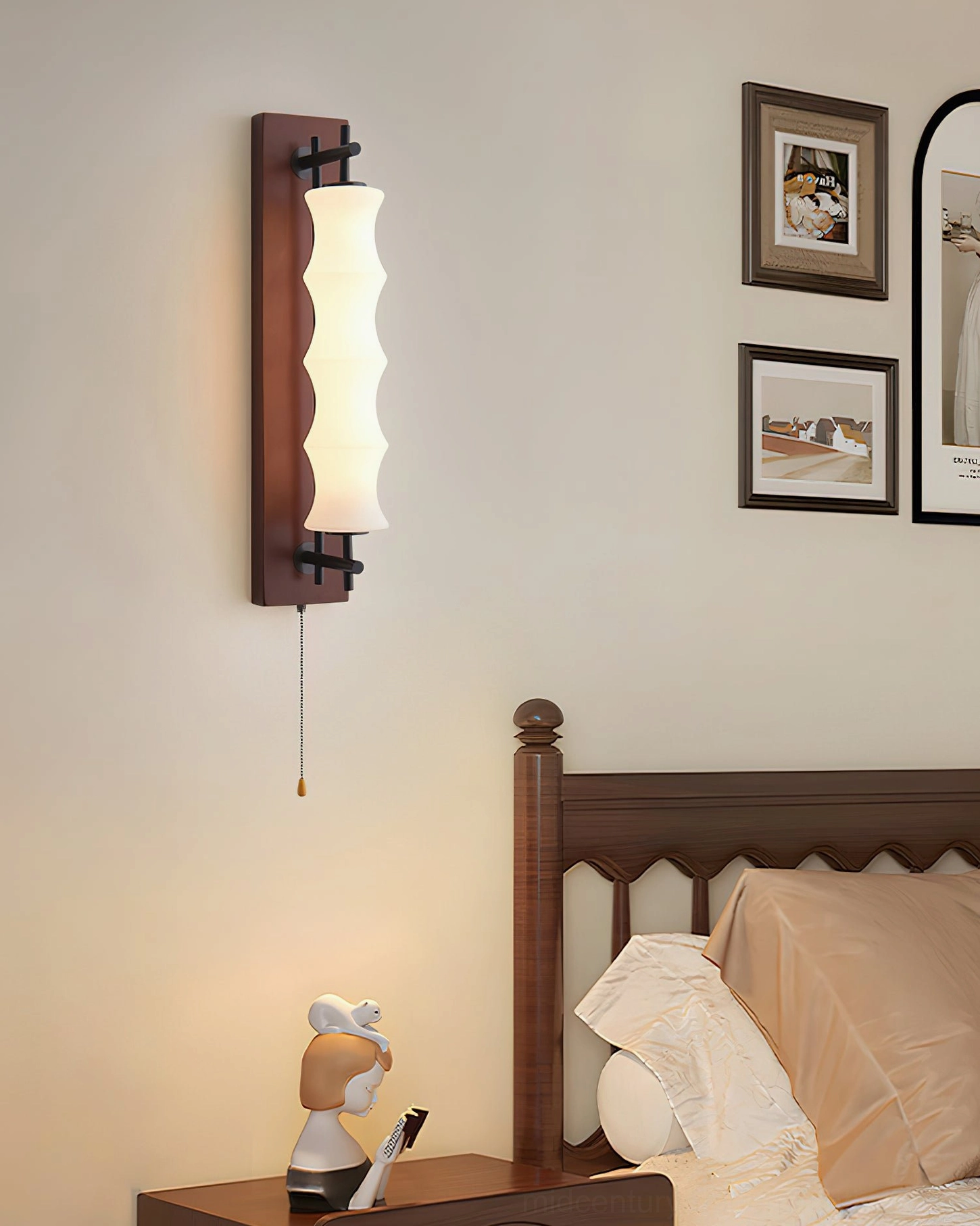Nesta wavy glass sconce with dark walnut finish mounted above wooden bed frame with wall art, warm glow