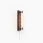 Nesta wavy glass wall sconce with dark walnut finish and brushed metal gooseneck arm mounted on minimalist white wall