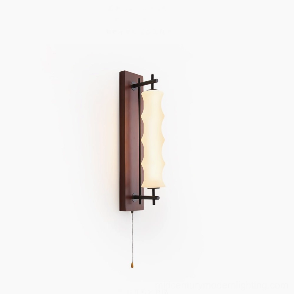 Nesta wavy glass wall sconce with dark walnut finish and brushed metal gooseneck arm mounted on minimalist white wall