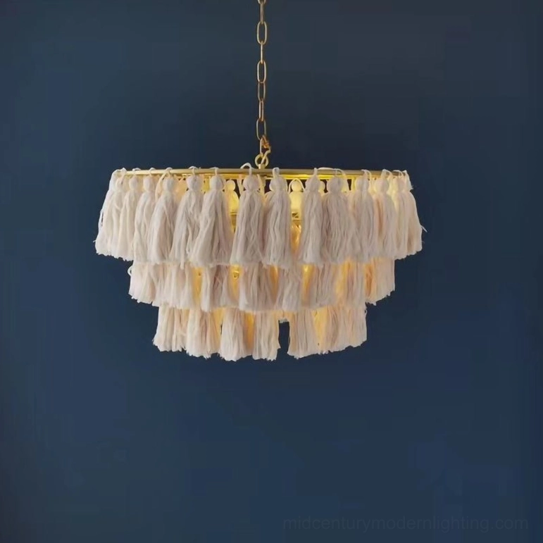 Off-white handcrafted tassel light with neutral palette in cozy bohemian home environment