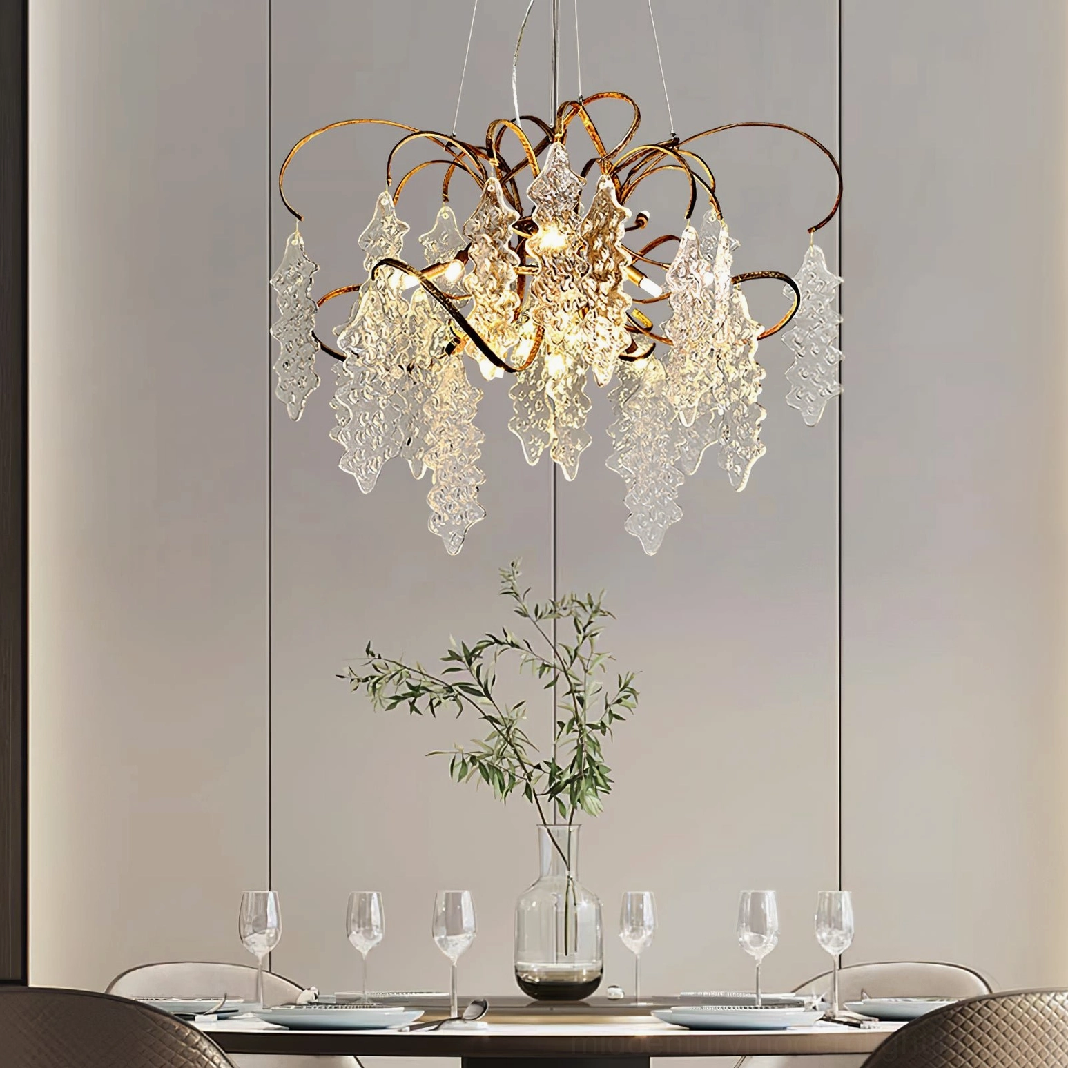 Niagara Chandelier in formal dining room setting with table service showing brass curved frame and glass