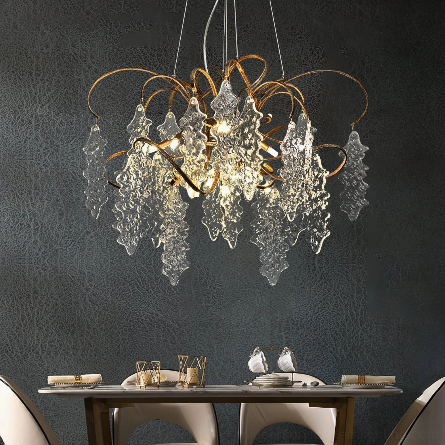 Niagara Glass Chandelier in modern dining room above table with aged brass frame and textured pendants