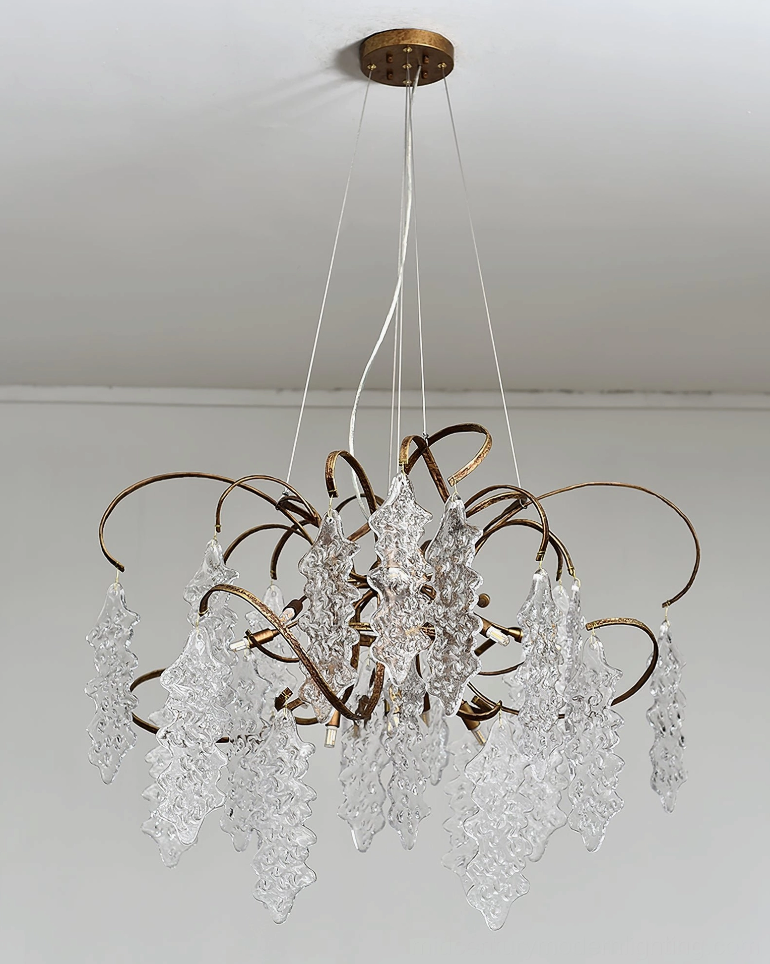 Niagara Round Glass Chandelier displaying curved organic frame and textured pendant details