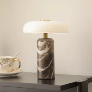 Nico portable LED lamp styled on living room side table with vintage teacup and warm ambient lighting