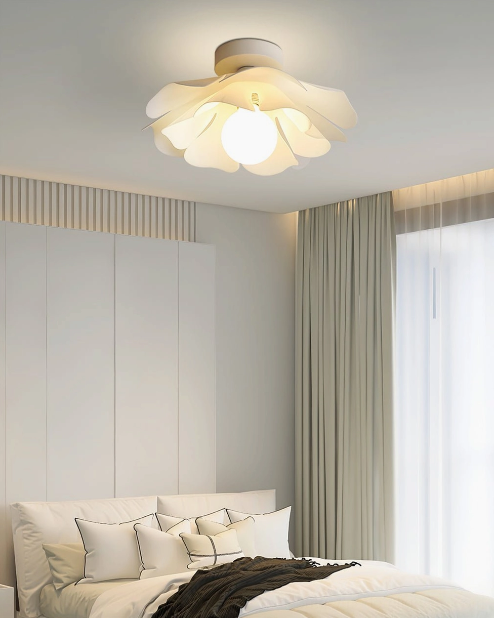 Nightbloom ceiling lamp installed in modern master bedroom, creating soft ambient lighting over upscale furniture
