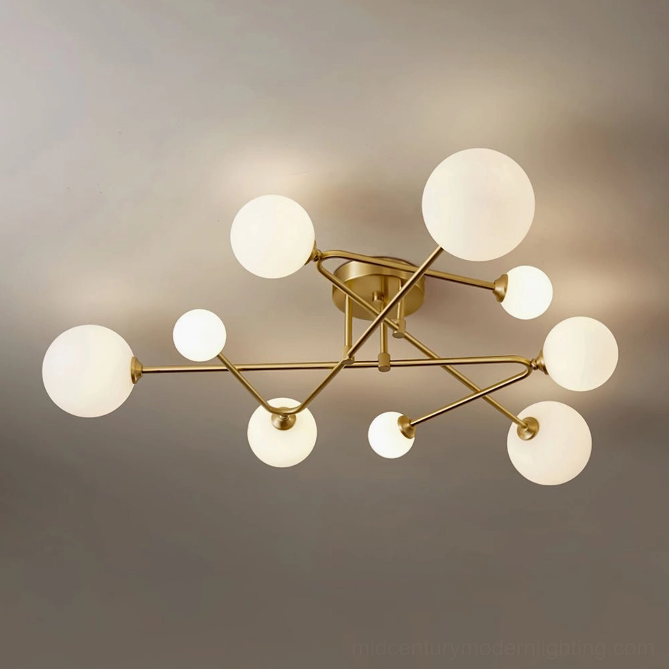 9-head sputnik ceiling lamp low angle showing polished brass frame and frosted glass shades in residential interior