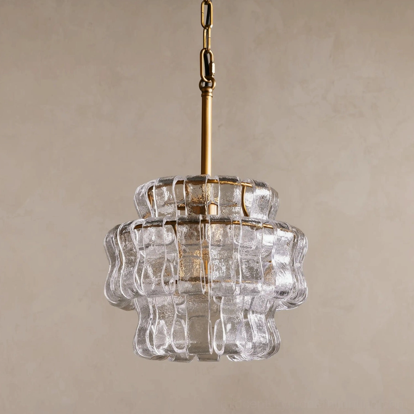Unlit Nirsa cascade pendant with clear rippled glass panels and brass metal frame