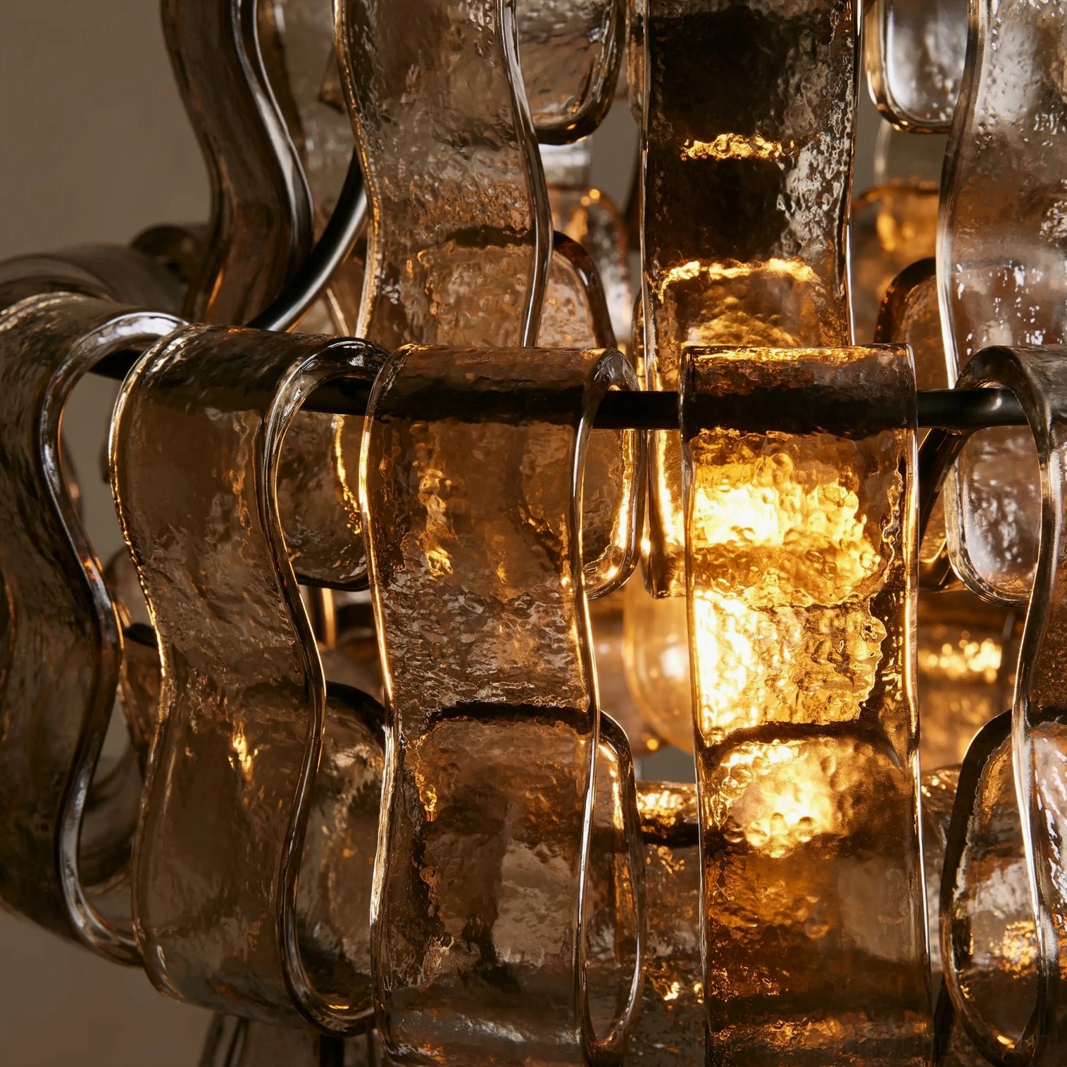 Nirsa pendant light close-up showing frozen textured glass surface and light diffusion