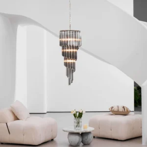 Noir spiral glass chandelier illuminated in minimalist white luxury living room, three-quarter view with modern furnishings