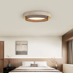 Nolan travertine flush mount ceiling light installed in modern master bedroom with warm neutral decor