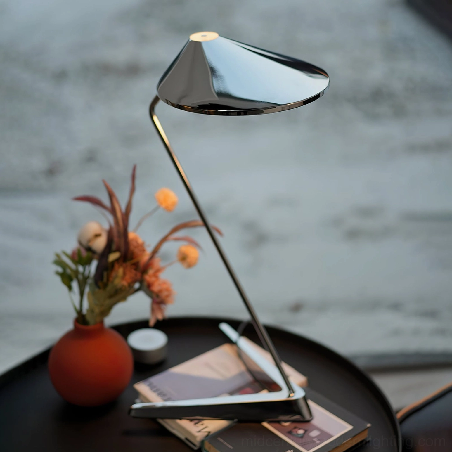 Modern chrome desk lamp with zigzag metal stem on coffee table interior scene