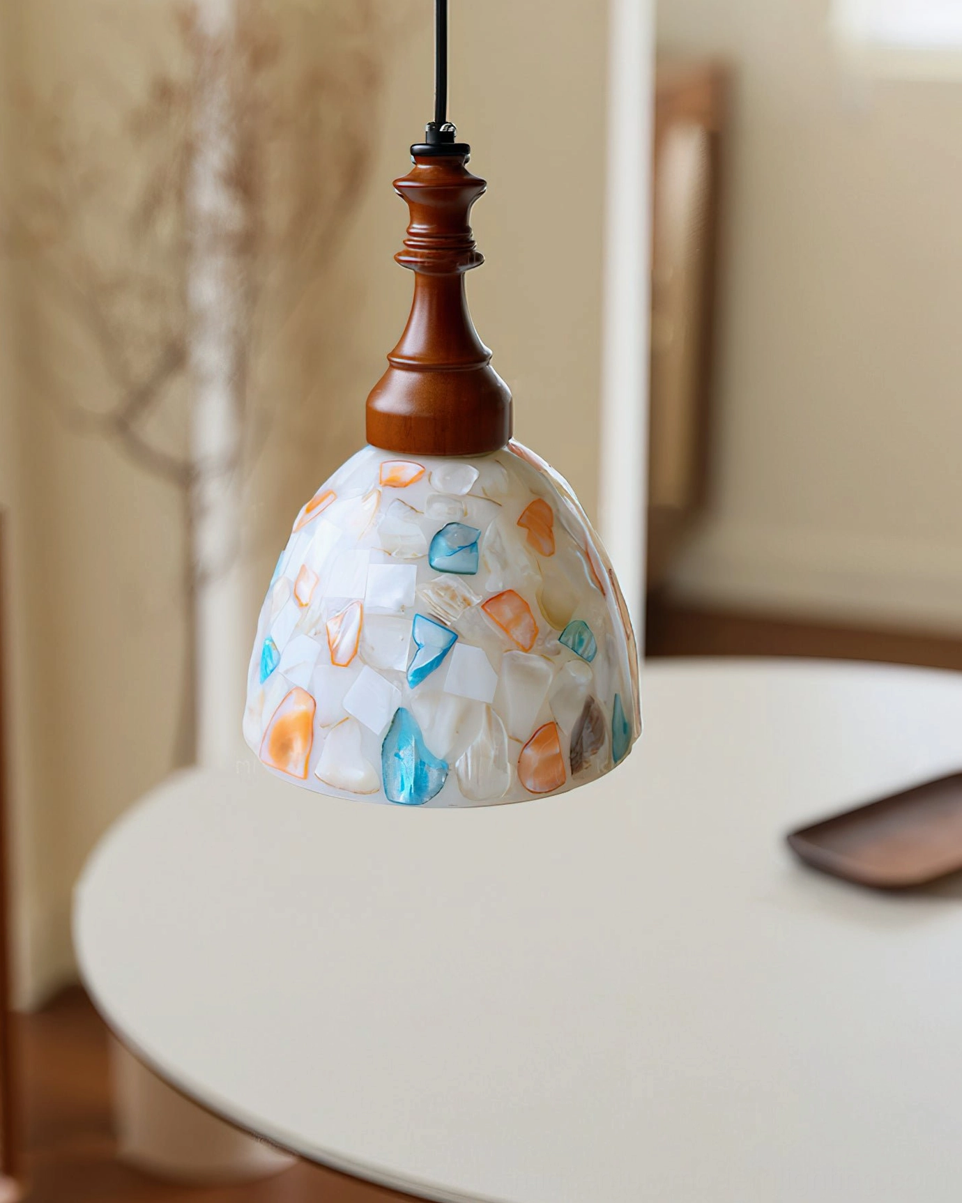 Nonna stained glass pendant light three-quarter view in living room with striped sofa, vintage hand-crafted design