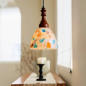 Nonna pendant light in farmhouse dining area near window, vintage mosaic glass creating warm atmospheric lighting