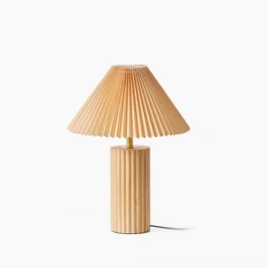 Nora mid-century modern table lamp full front view with pleated fabric shade and fluted wood base on white background