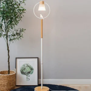 Scandinavian floor lamp arc design styled with potted plant and wall art in contemporary home decor