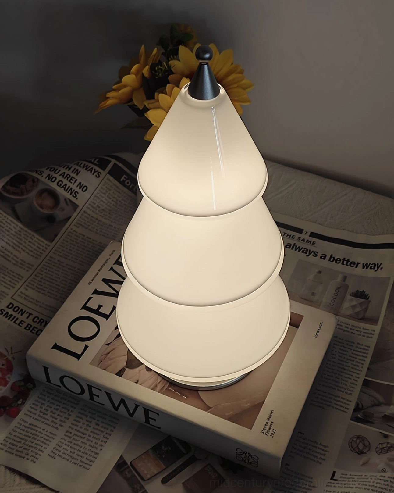 Nordic minimalist cone-shaped LED lamp creating soft warm glow for ambient home lighting and interior design
