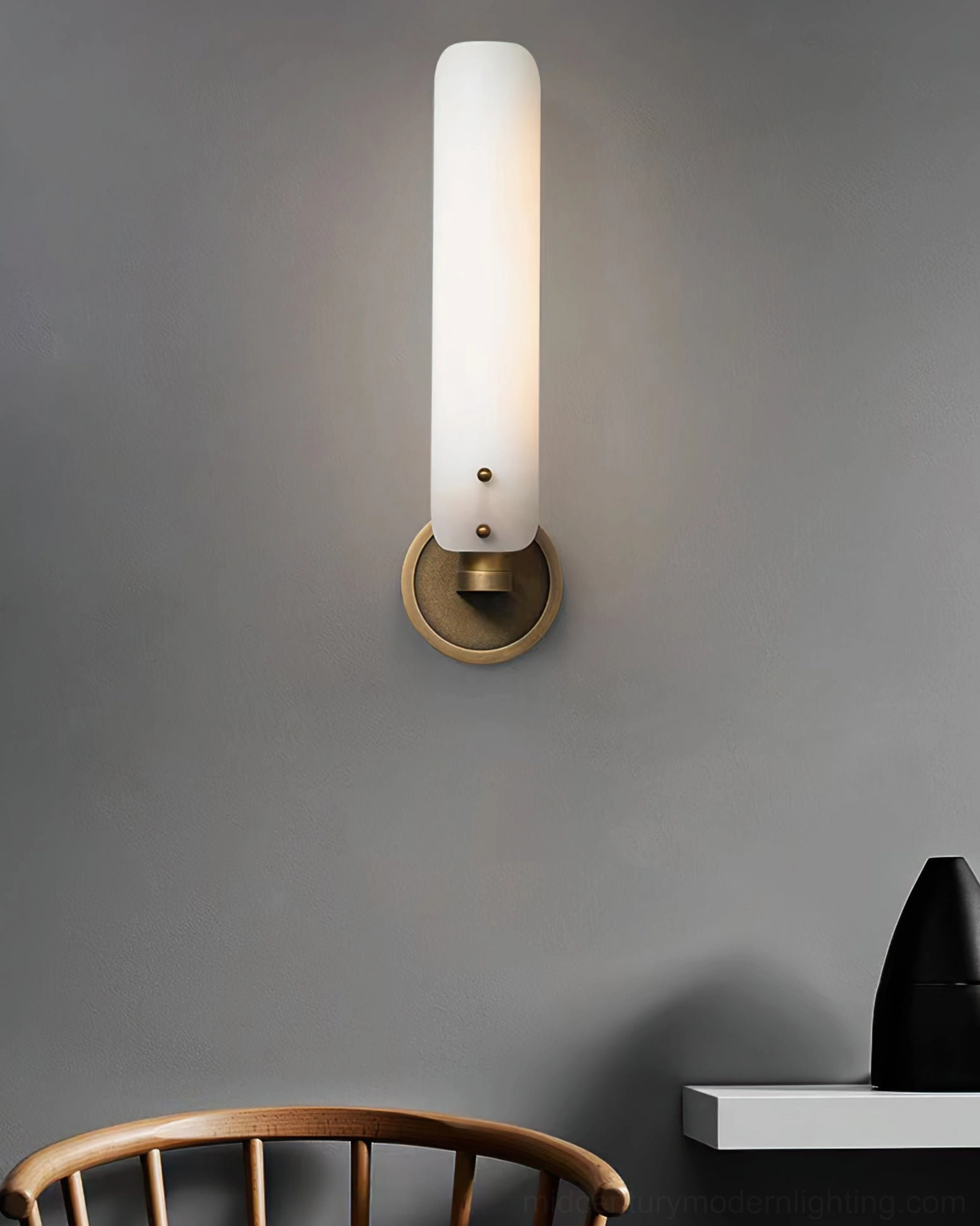 Minimalist single wall lamp in corner study or dining area with neutral home decor styling