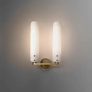 Lit Norwalk wall sconce with warm ambient glow, minimalist luxury modern interior accent lighting